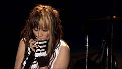 Yumi on harmonica